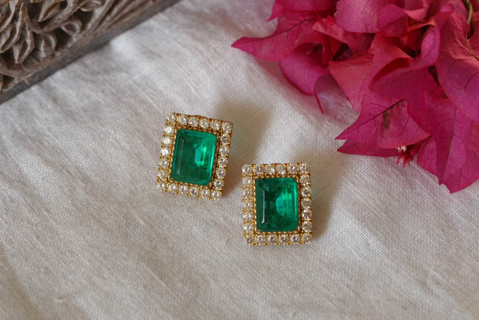 Oval Emerald & Diamond Halo Stud Earrings in Yellow Gold